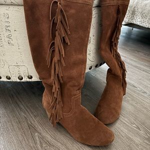 Suede knee high boots.